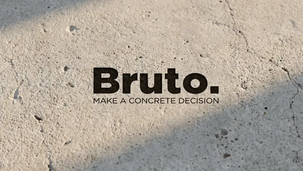 Bruto logo displayed on a textured concrete surface, showcasing the brand identity designed by Marra as part of a premium branding and creative direction project.